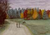 Couple holding hands walking down an path in autumn with a dog
